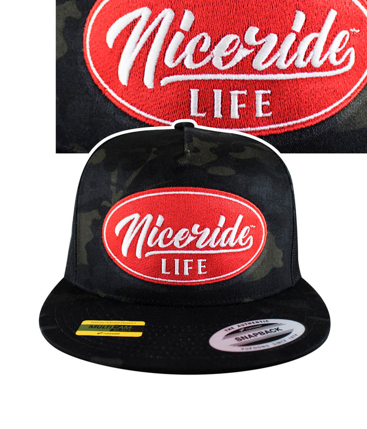 Nicerride Life snapback hat featuring a bold red embroidered logo on a black camo background.