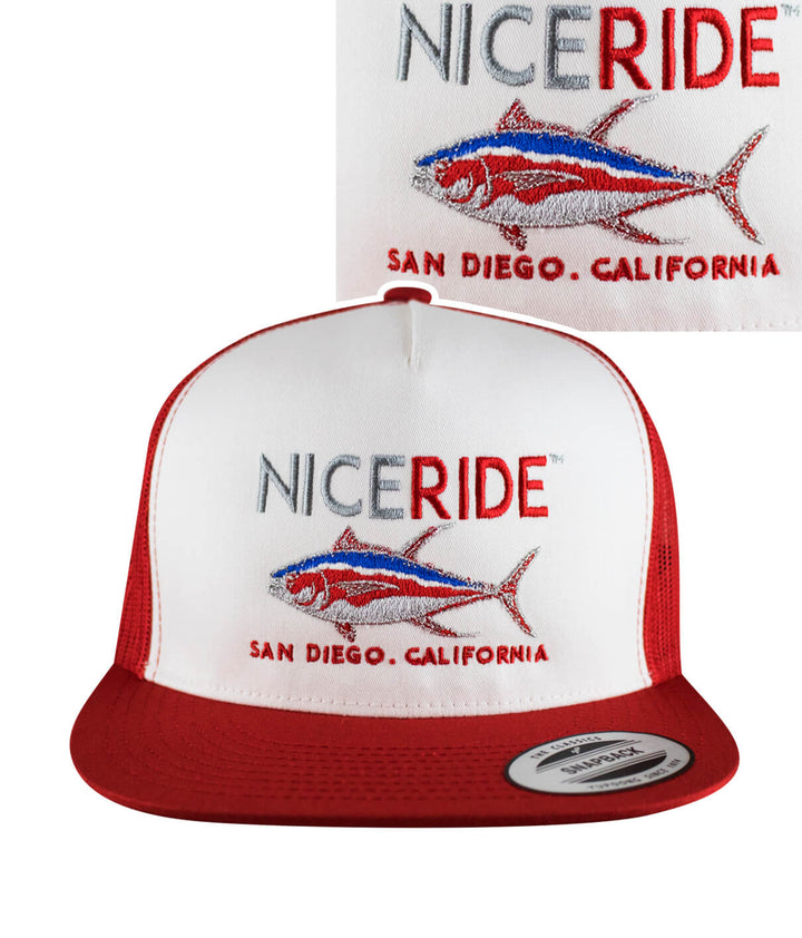 A red and white trucker hat with a fish embroidered on it.