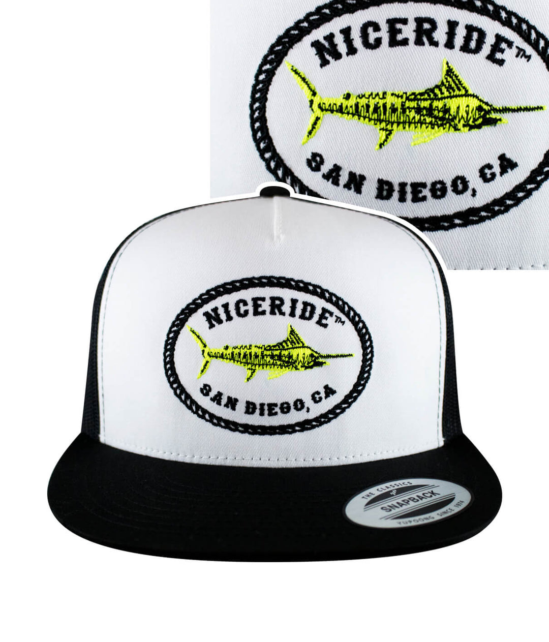A black and white trucker hat with a neon fish embroidered on it.