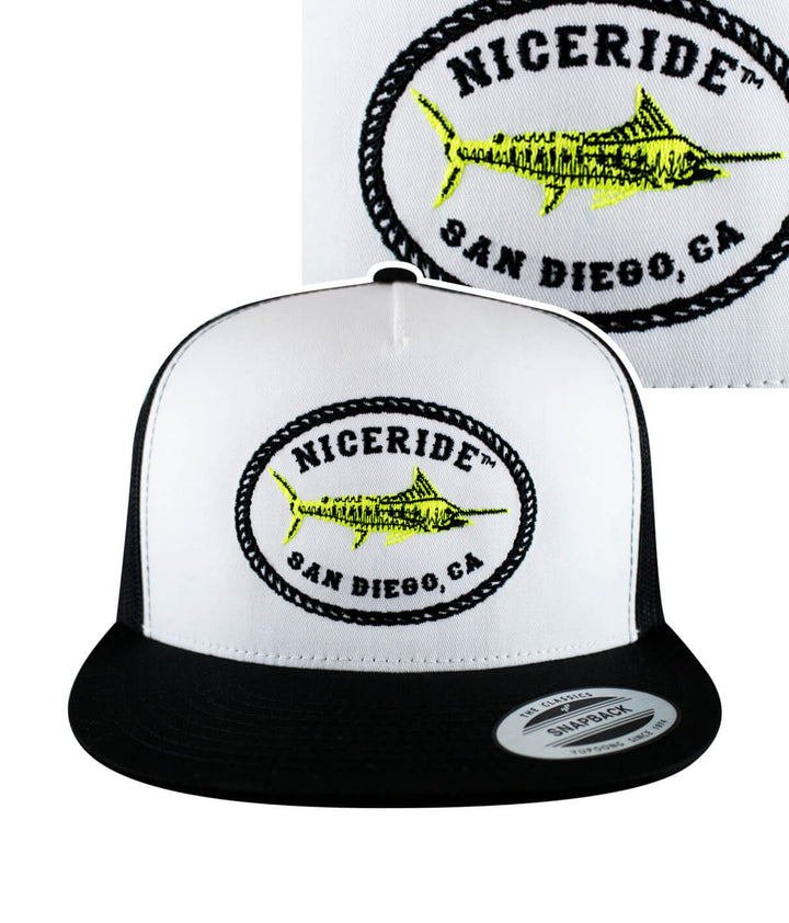 A black and white trucker hat with a neon fish embroidered on it.