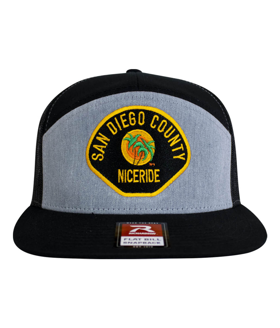 The Badge 7 Panel Trucker Hat featuring San Diego County NICERIDE embroidered design.
