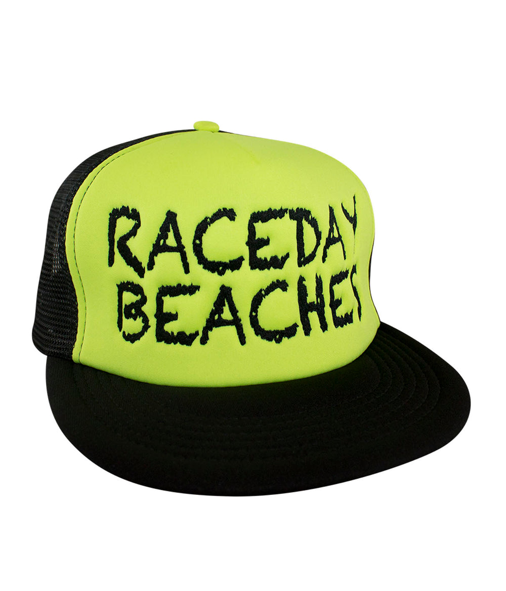 Raceday Beaches District Foam Trucker Hat in bright yellow with black mesh, featuring the word 'Raceday Beaches'.