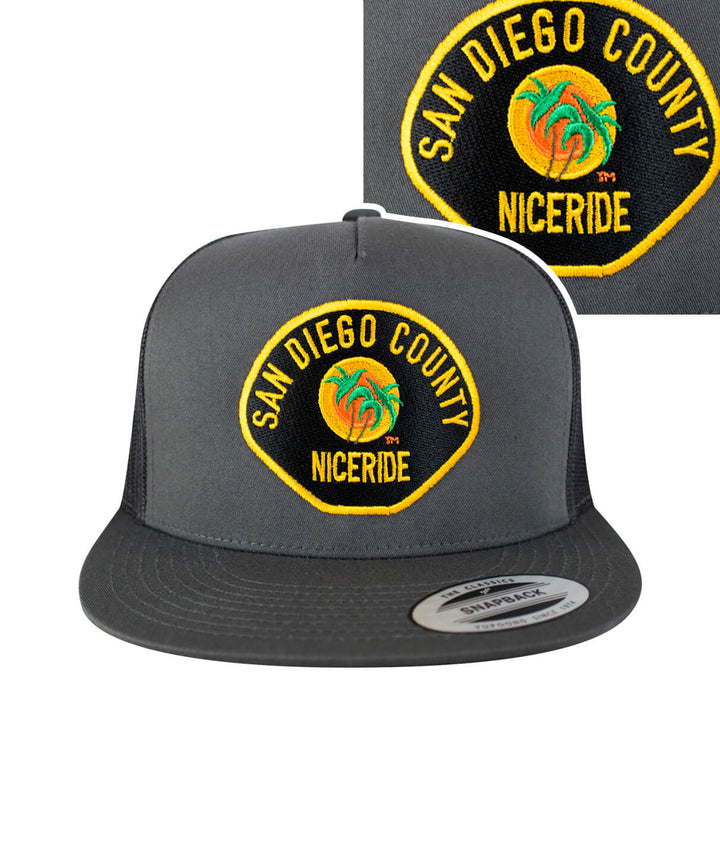 The Badge Trucker Hat featuring San Diego County and NICERIDE embroidery, stylish baseball cap. Perfect hat for casual wear.