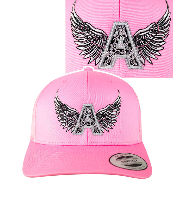 Angel Pink Retro Trucker Hat with embroidered A and wings design, perfect for stylish outdoor wear.