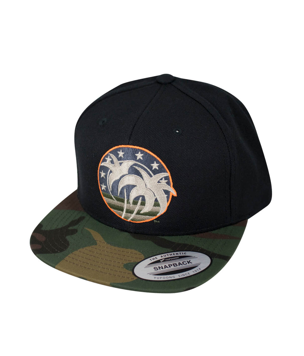 Hat featuring a black crown and camo brim with embroidered logo, perfect for casual wear and outdoor activities.
