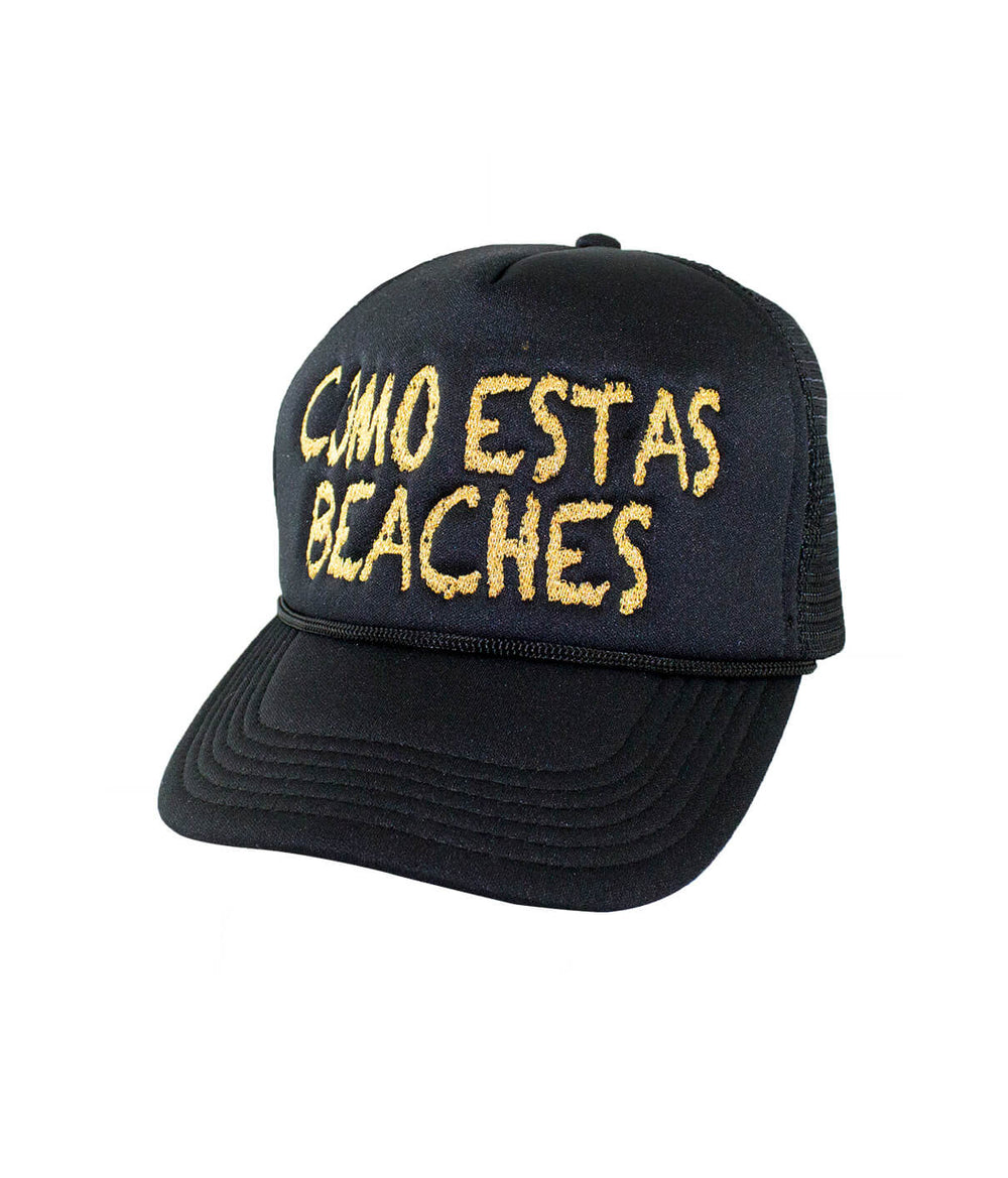 Como Estas Beaches foam trucker hat featuring black color and bold embroidered text.