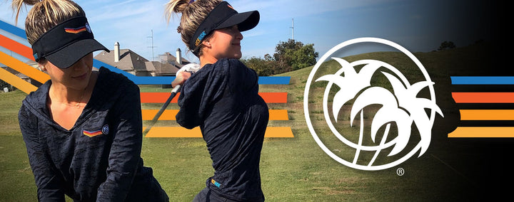 Woman wearing a black Aquarius visor, showcasing style while golfing on a sunny day.