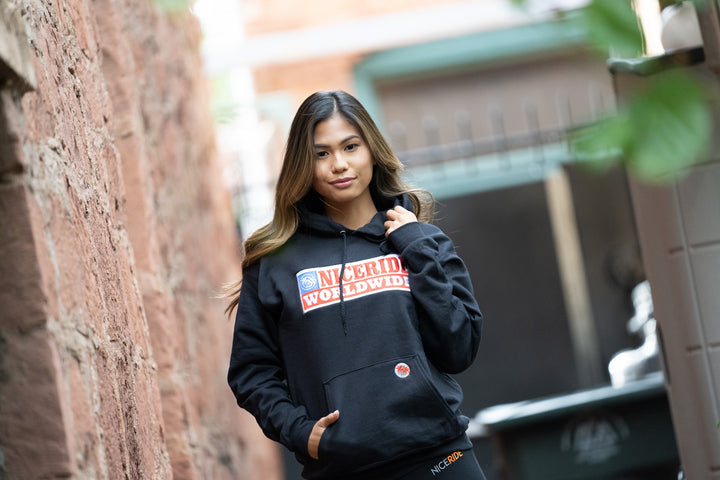 Nashville black pullover hoodie for men and women, featuring NICERIDE design, model wearing in urban setting.